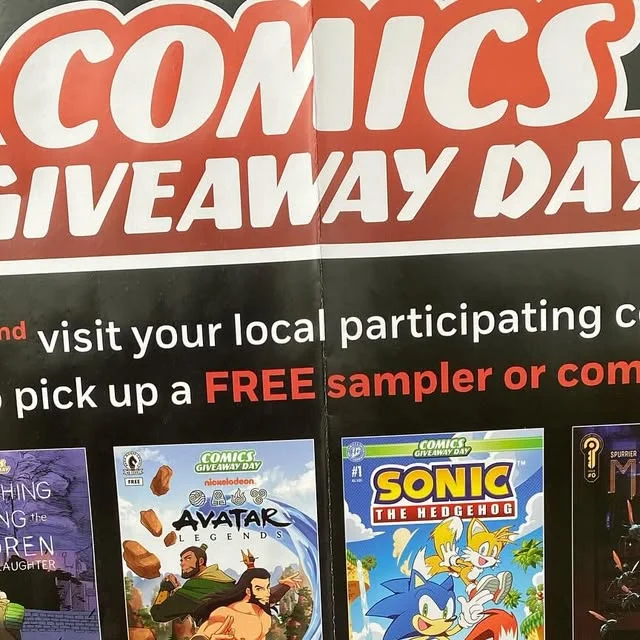 Comic giveaway day poster detail with several sample comic covers along the lower edge